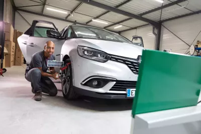 A person calibrating a car
